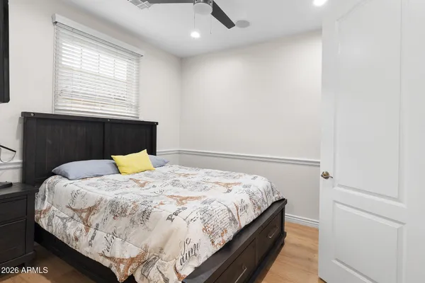 a living room with lots of furniture and a book shelf