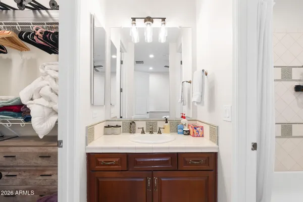 a front view of a residential apartment building with a yard