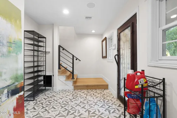 a bedroom with furniture and a window