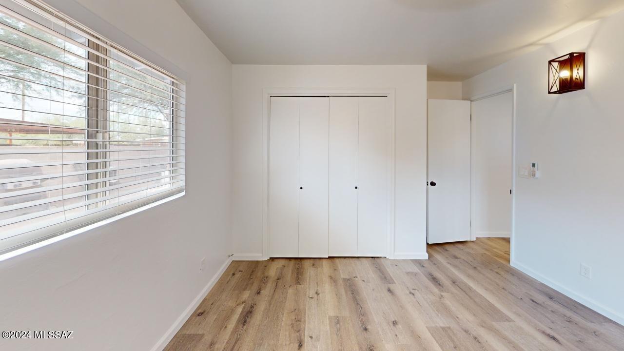2118 North Rita Avenue Tucson, AZ 85716 - Photo 7 of 17 a view of a room with wooden floor and window