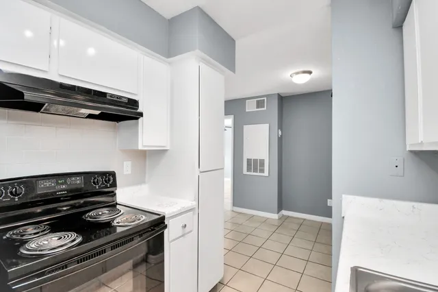a view of a backyard with a patio and outdoor seating