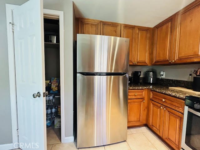 7304 Exeter Street, Unit E Paramount, CA 90723 - Photo 4 of 36 Open pantry for added storage and convenience.