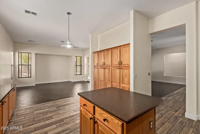 a kitchen with stainless steel appliances granite countertop a sink a refrigerator and a stove