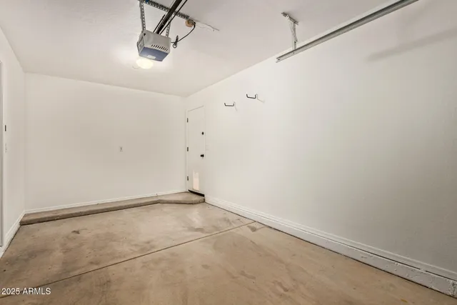 a view of a street with a tree on the side of it