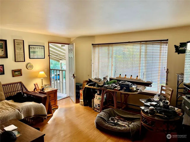 a room with furniture and wooden floor