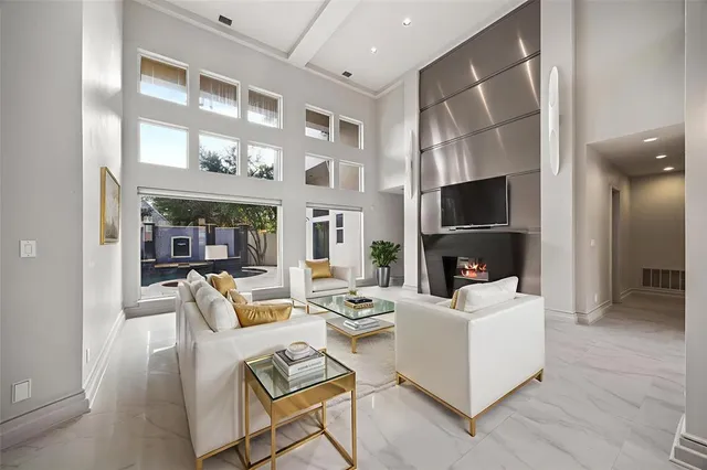 a living room with fireplace furniture and a flat screen tv