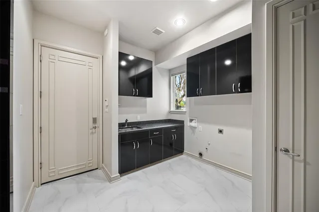 a spacious bathroom with a granite countertop sink a mirror and shower