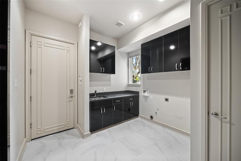 5608 Stone Cliff Court Dallas, TX 75287 - Photo 22 of 35 a spacious bathroom with a granite countertop sink a mirror and shower