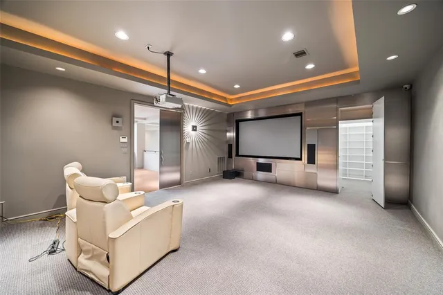 a living room with furniture and a ceiling fan