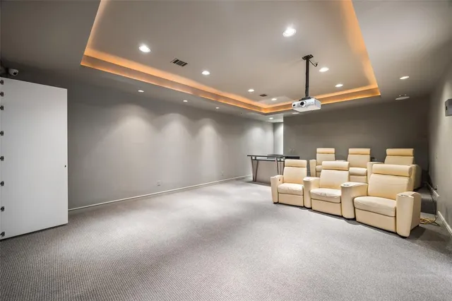 a view of a house with swimming pool and sitting area