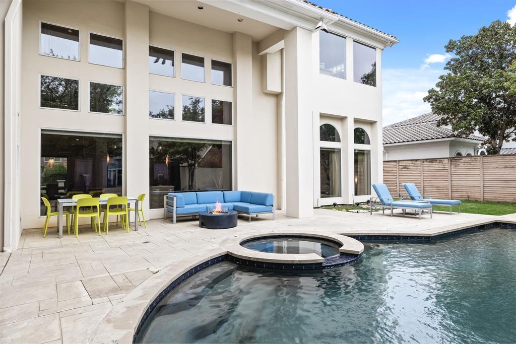 5608 Stone Cliff Court Dallas, TX 75287 - Photo 27 of 35 a view of a house with swimming pool and sitting area