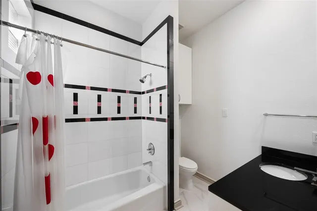a bathroom with a double sink shower and a mirror