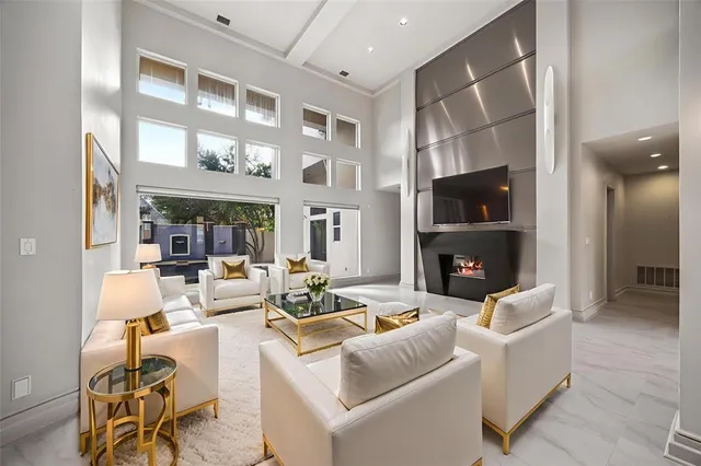 a living room with fireplace furniture and a flat screen tv