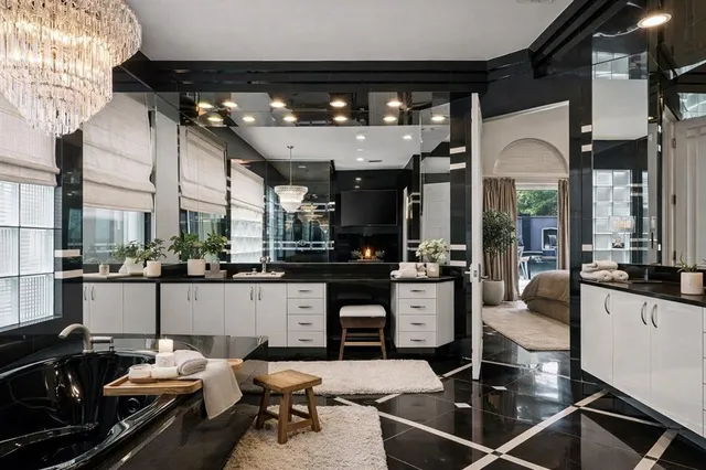 a kitchen with stainless steel appliances kitchen island granite countertop a sink and cabinets