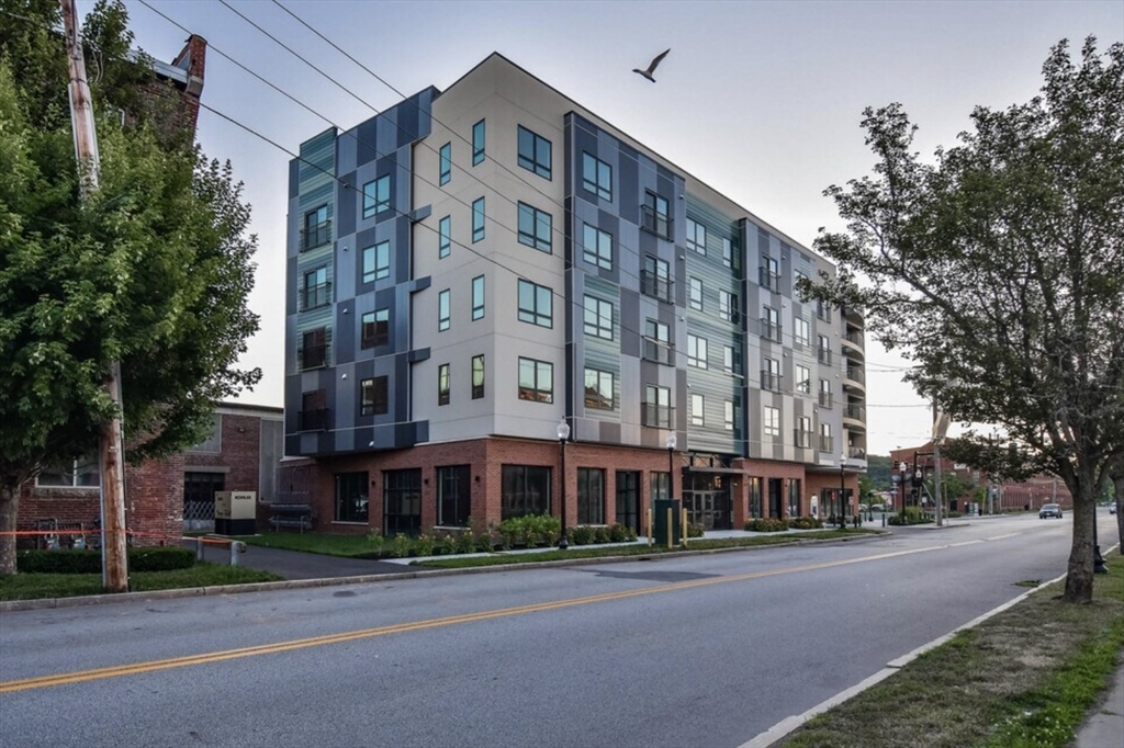 215 Canal Street, Unit 1 Lawrence, MA 01840 - Photo 6 of 6 front view of a building with a street