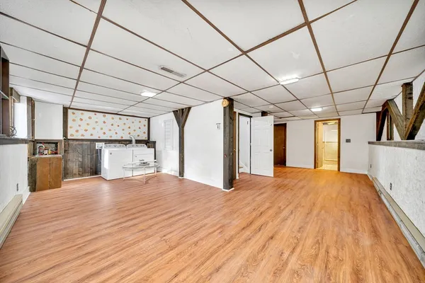 a view of a livingroom with wooden floor