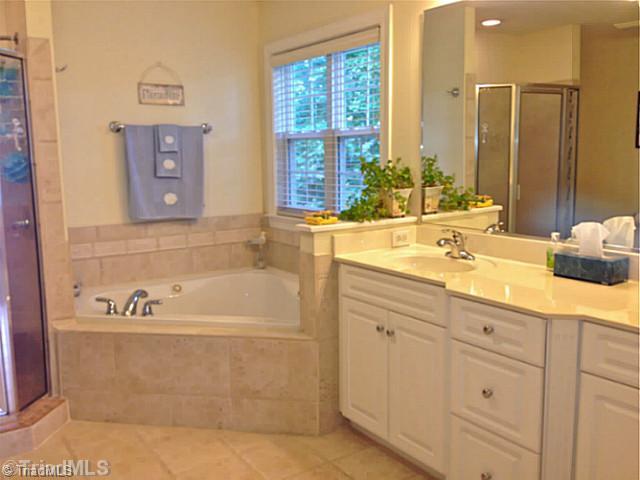 7804 Wilson Farm Road Summerfield, NC 27358 - Photo 13 of 16 Exterior Front. Master bathroom with built-in shelves