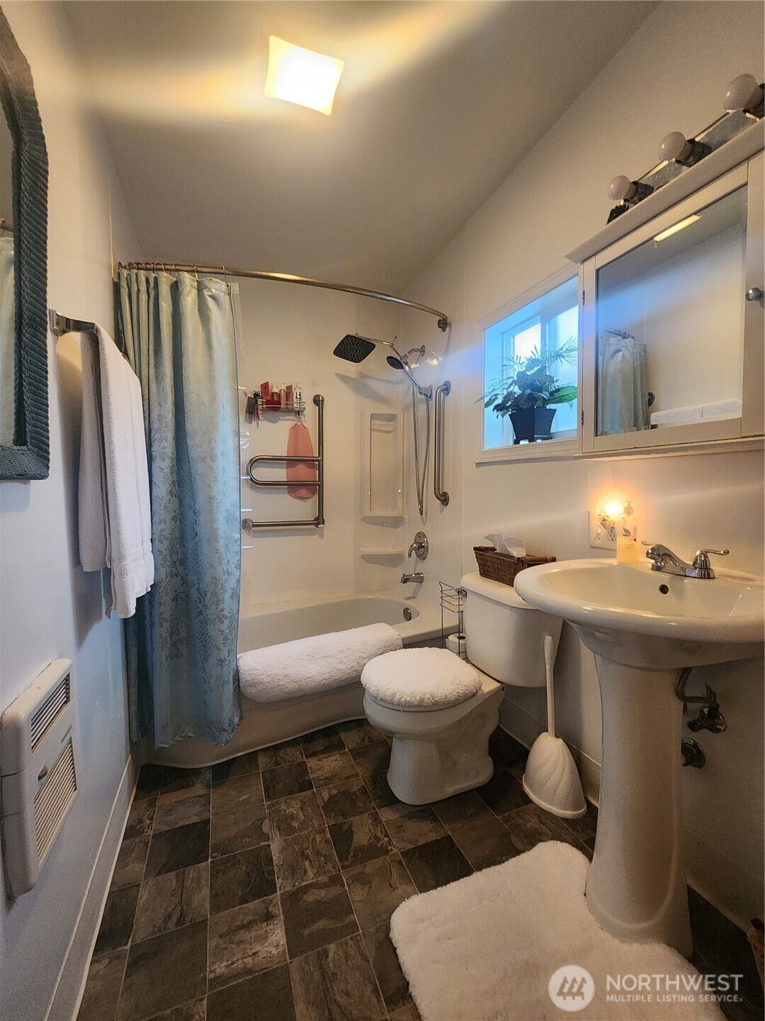 117 J Street Cosmopolis, WA 98537 - Photo 19 of 33 a bathroom with a sink toilet and shower