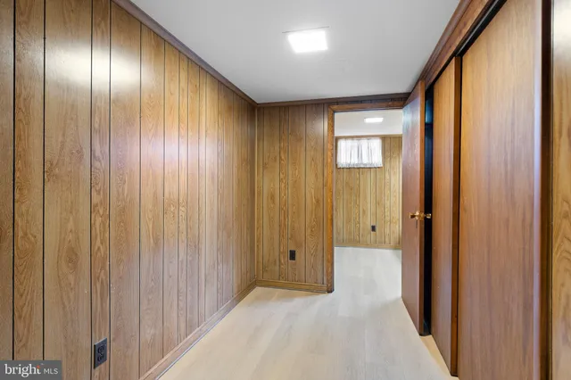 a view of a hallway with wooden wooden walls