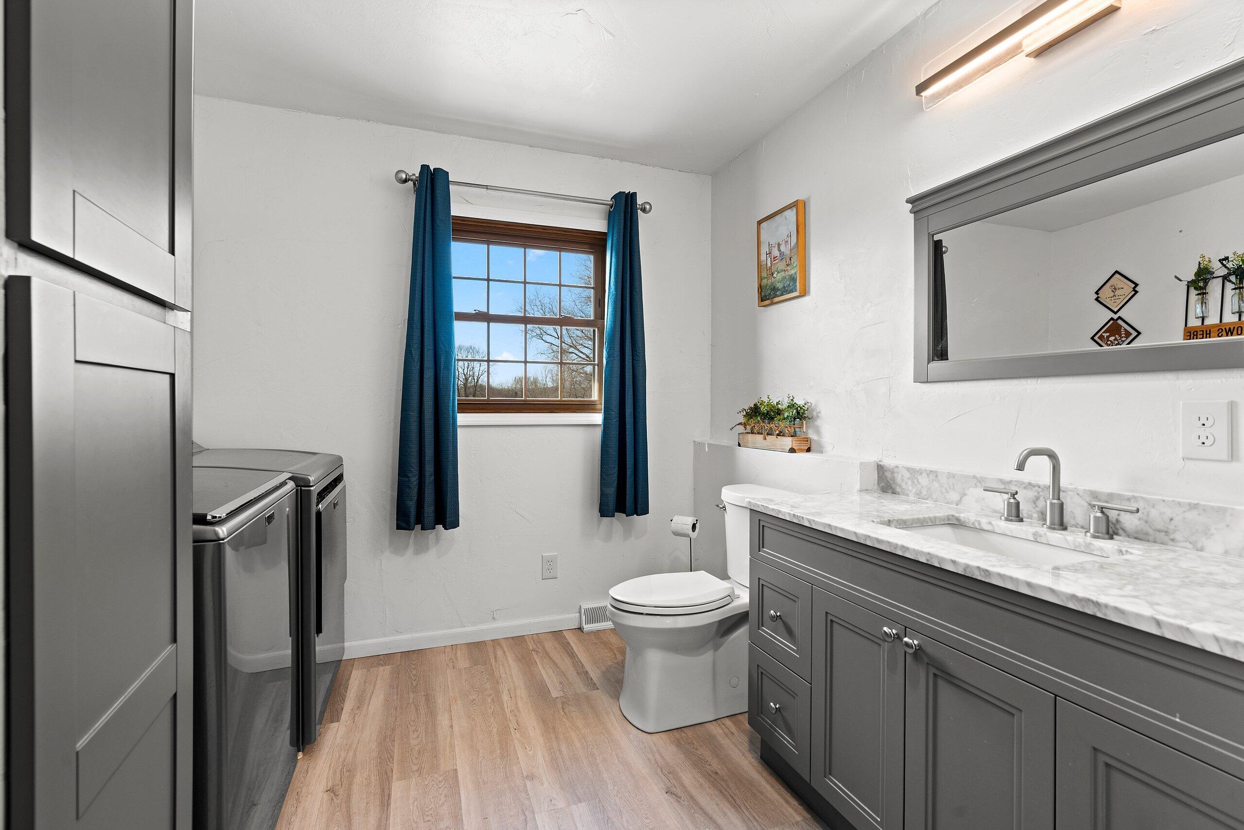 N6580 County Rd O J Plymouth, WI 53073 - Photo 22 of 39 Laundry in Full Bath