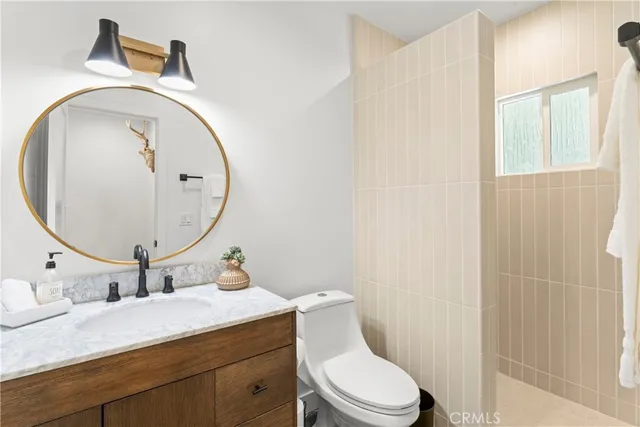 a bedroom with a bed and chair