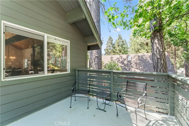 a backyard of a house with barbeque oven and outdoor seating