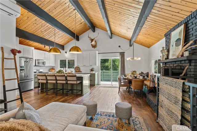 a table and chairs with wooden floor
