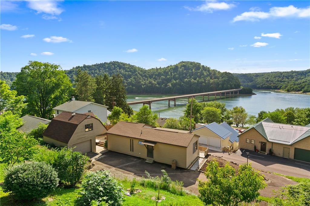 859 Lake Road Addison, PA 15411 - Photo 1 of 24 an aerial view of a house with pool lake view and mountain view