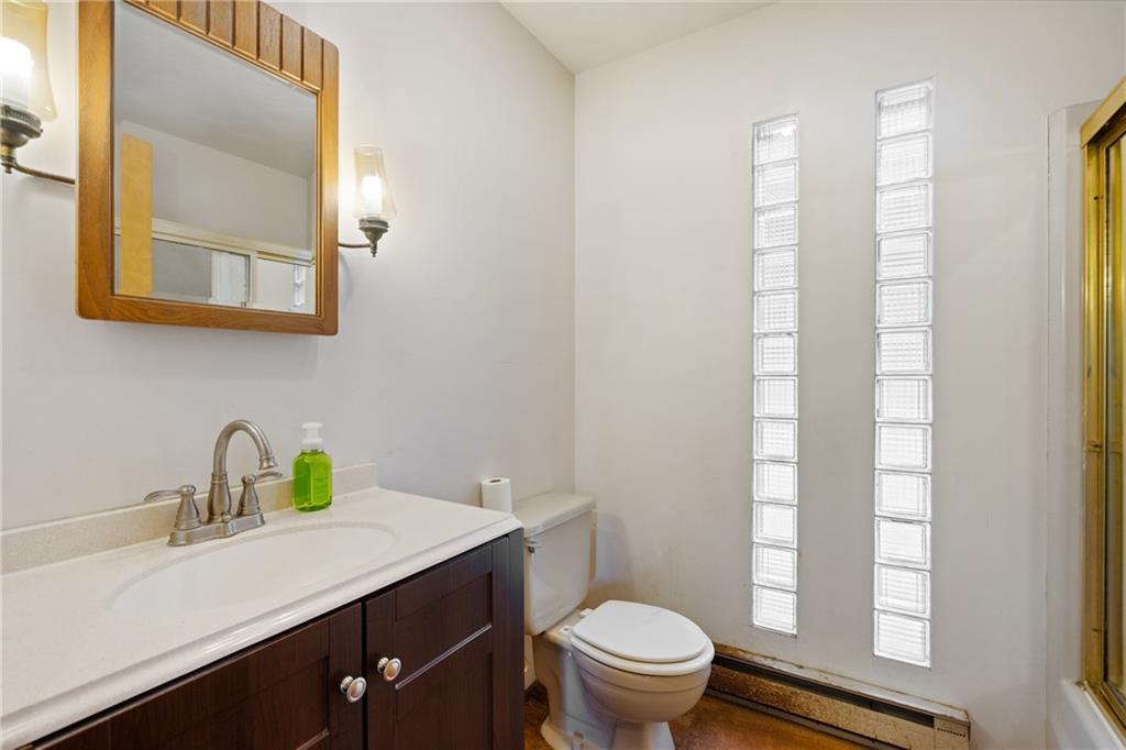859 Lake Road Addison, PA 15411 - Photo 14 of 24 a bathroom with a sink a toilet and a mirror