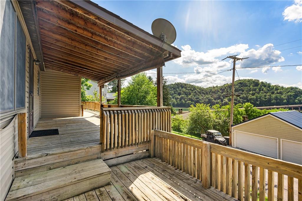 859 Lake Road Addison, PA 15411 - Photo 3 of 24 a view of a balcony with wooden floor