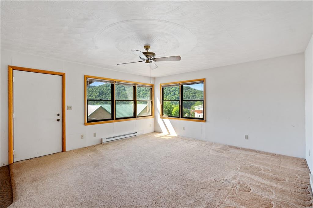 859 Lake Road Addison, PA 15411 - Photo 7 of 24 a view of an empty room with a window
