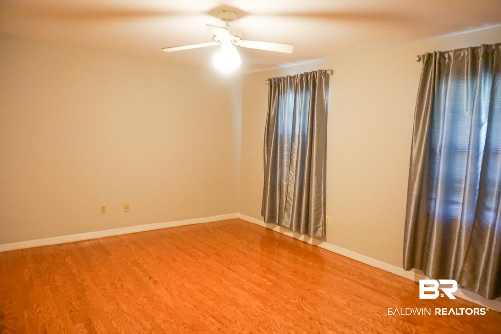 255 Suffolk Road Mobile, AL 36608 - Photo 27 of 29 Empty room with light wood-type flooring and a ceiling fan