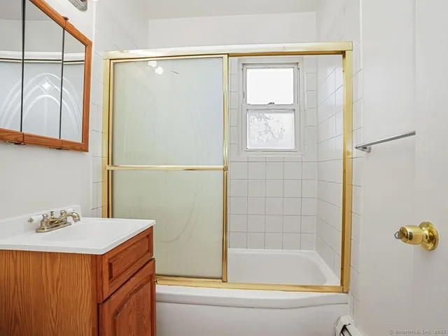 a bathroom with a bathtub and a sink