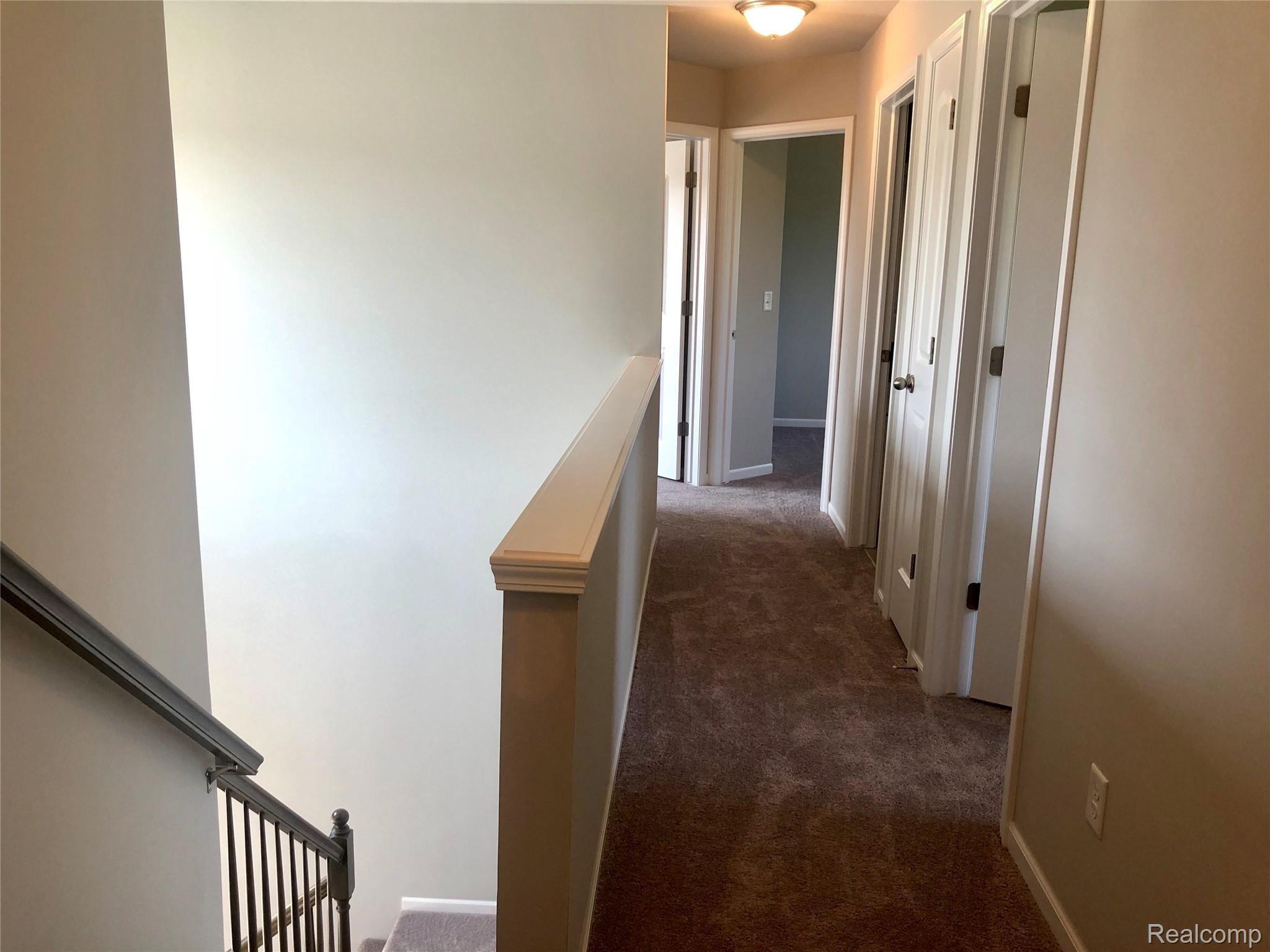 42845 Colonial Road Belleville, MI 48111 - Photo 11 of 21 Upstairs Hallway