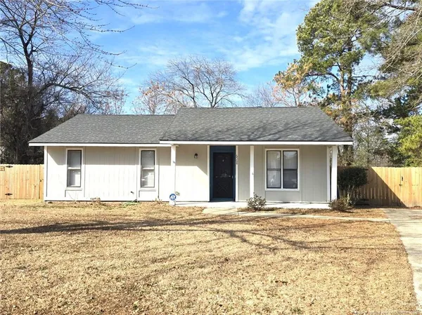 a house with trees in the background