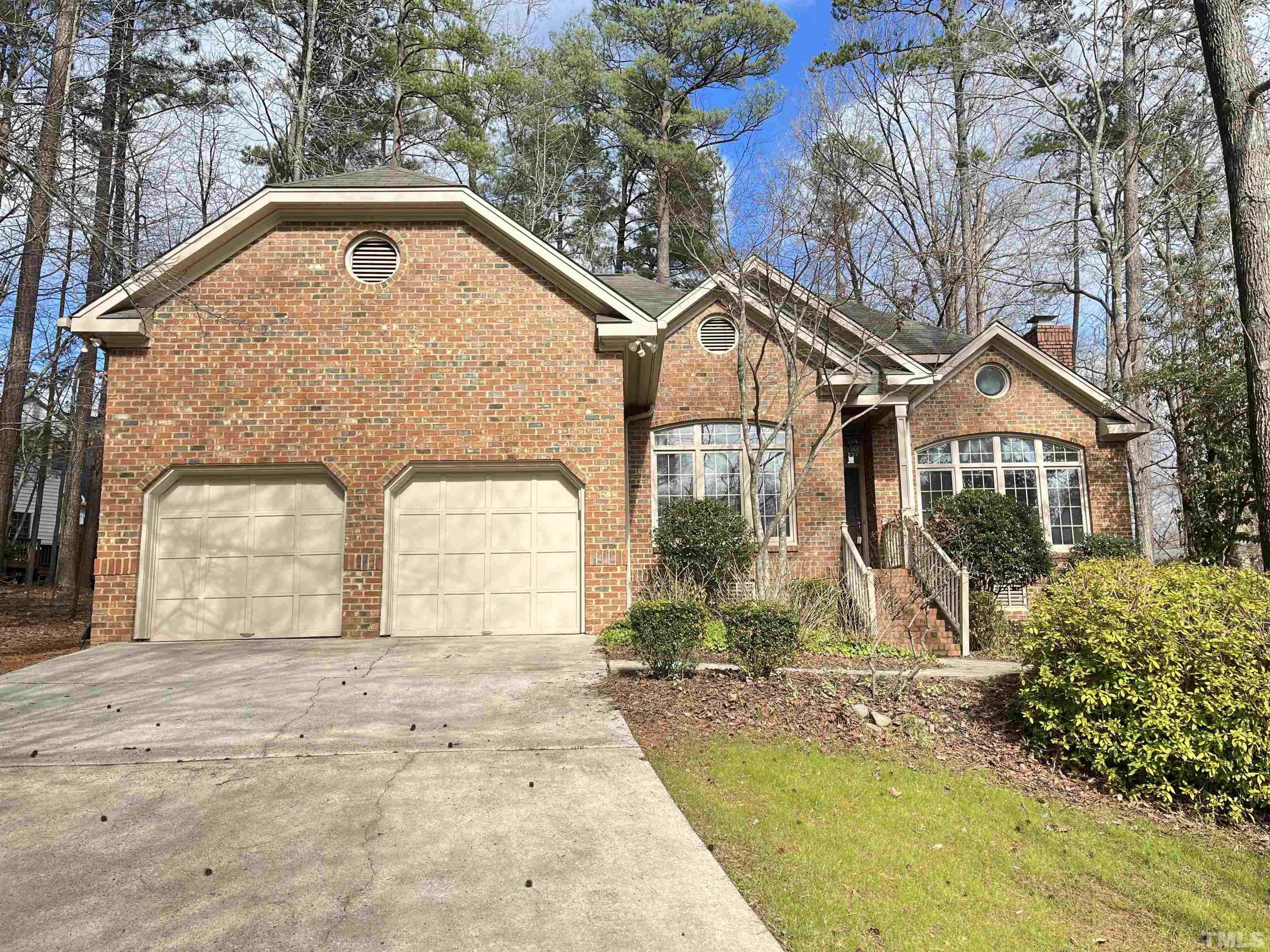 4100 Starboard Court Raleigh, NC 27613 - Photo 1 of 17 a front view of a house with garden
