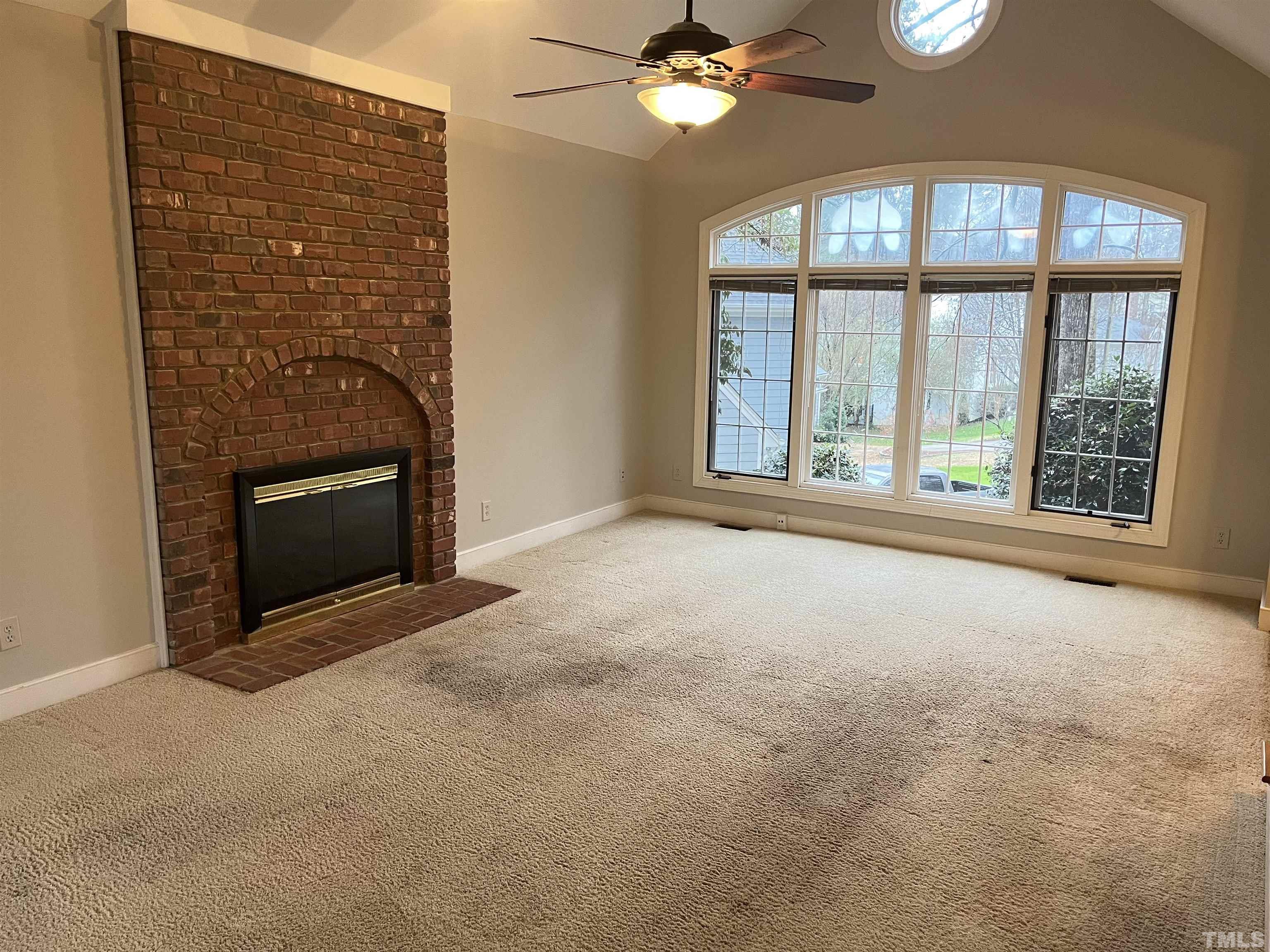 4100 Starboard Court Raleigh, NC 27613 - Photo 4 of 17 a view of an empty room with a fireplace