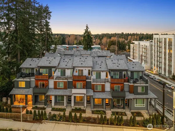 a front view of a residential apartment building with a yard
