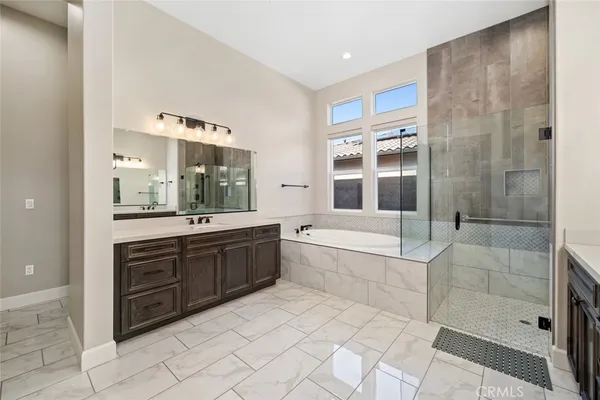 a bathroom with a double vanity sink and mirror