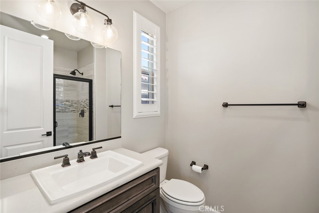 981 Trail View Place Nipomo, CA 93444 - Photo 33 of 56 a bathroom with a sink vanity mirror and toilet