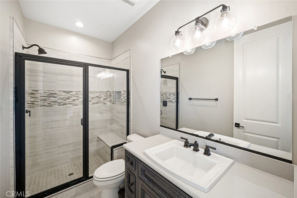 981 Trail View Place Nipomo, CA 93444 - Photo 36 of 56 a bathroom with a sink a toilet and shower