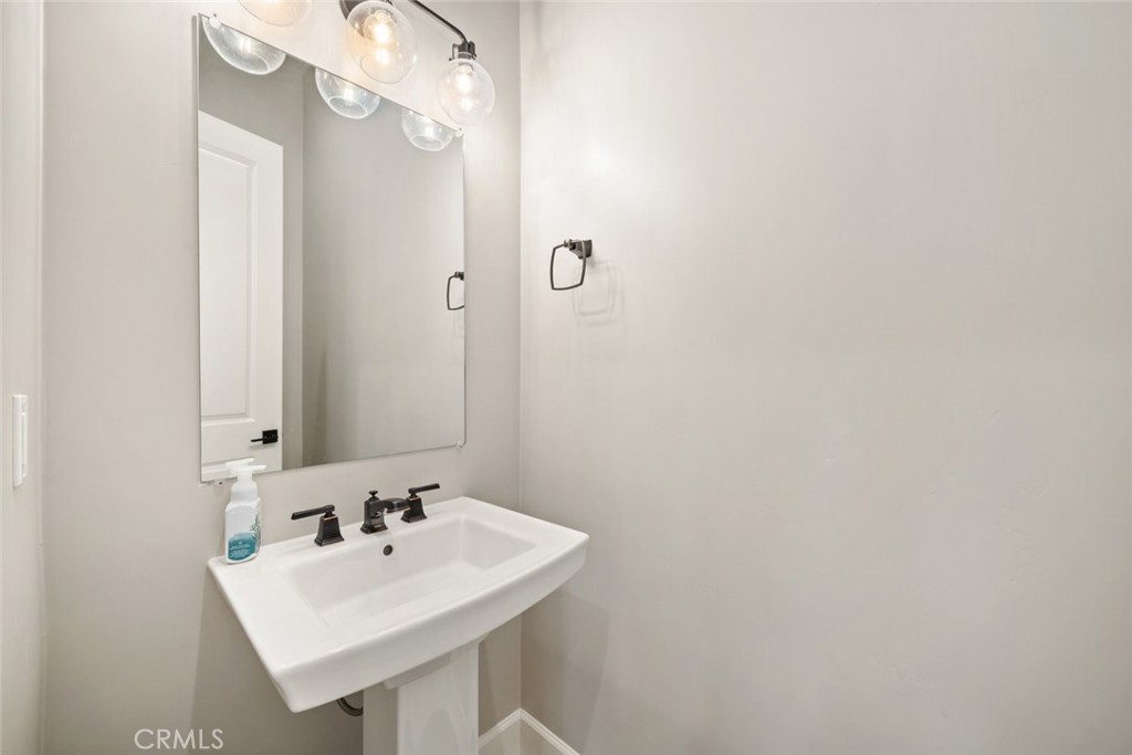 981 Trail View Place Nipomo, CA 93444 - Photo 38 of 56 a bathroom with a sink and a mirror