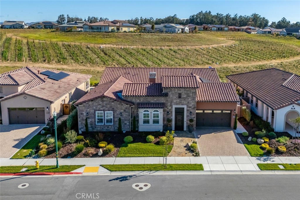 981 Trail View Place Nipomo, CA 93444 - Photo 40 of 56 a aerial view of a house with a swimming pool and a yard