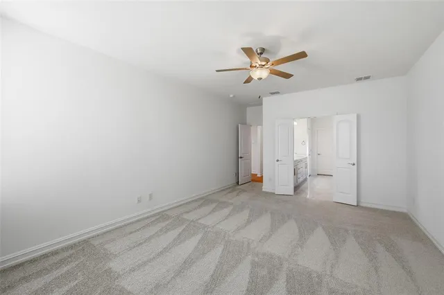 a view of a big room with carpet