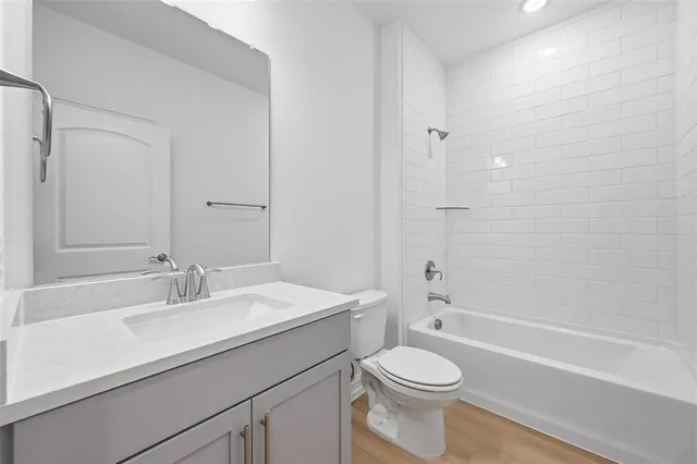 a bathroom with a sink a toilet and a bathtub