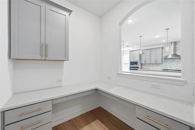 a view of a kitchen cabinets and window