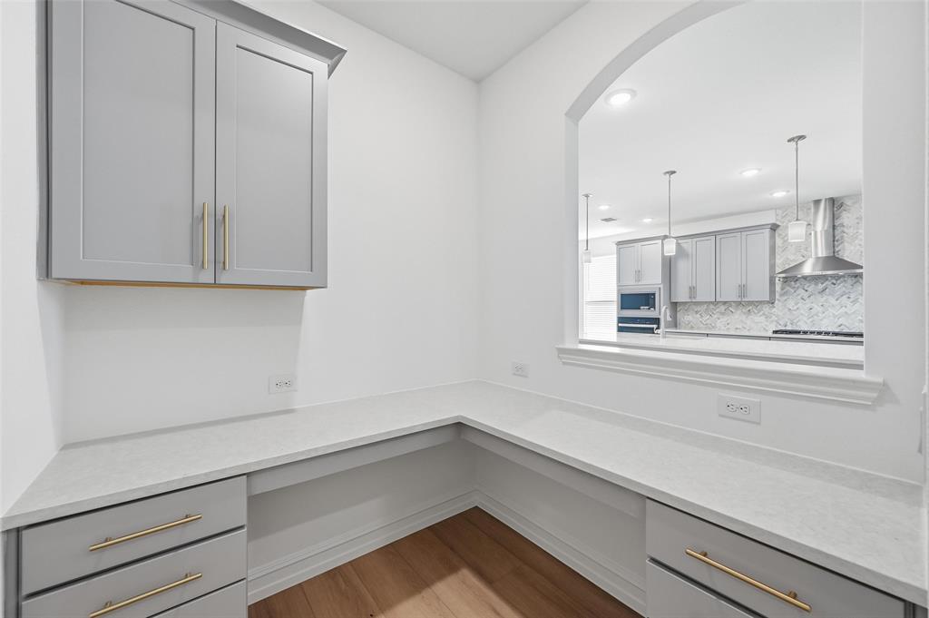 4365 Knight Street Midlothian, TX 76065 - Photo 8 of 33 a view of a kitchen cabinets and window