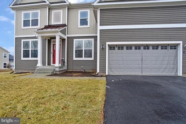 a front view of a house with a garage