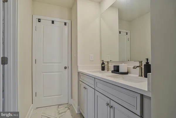 a view of a roof deck with furniture