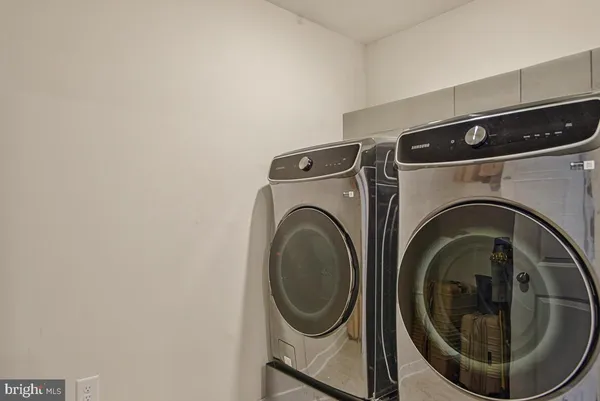 a view of a house with backyard porch and sitting area